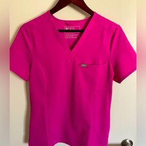 Slim fit scrub top in electric orchid color. LIMITED EDITION March 2022